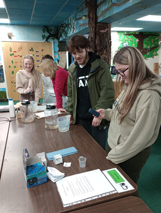 A level geography students doing indoor investigation work at Rosliston Foresty Centre.